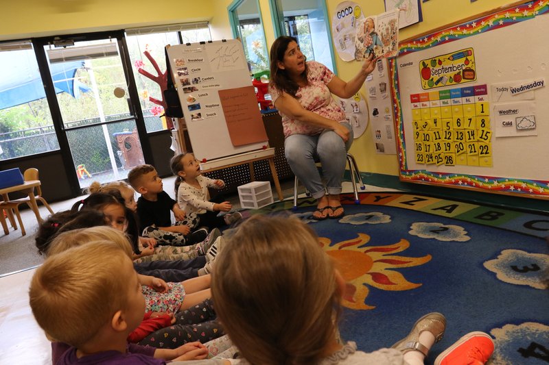 Kaleidoscope teachers working with children